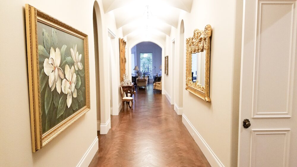 Antique Art and Mirrors Installed in Hallway